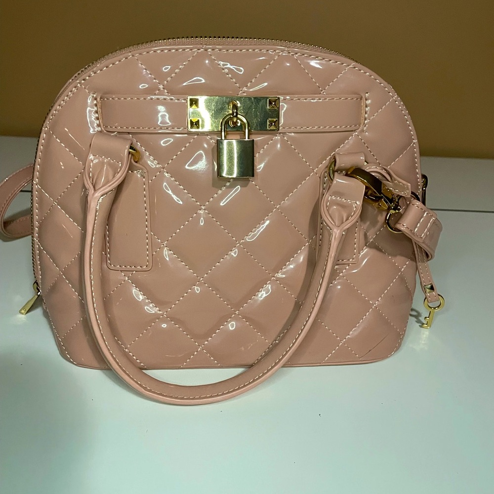 ALDO pink handbag with gold detail.